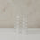 Transparente Bubble Vase aus Glas von Eulenschnitt mit geriffelter Form auf hellem Untergrund.