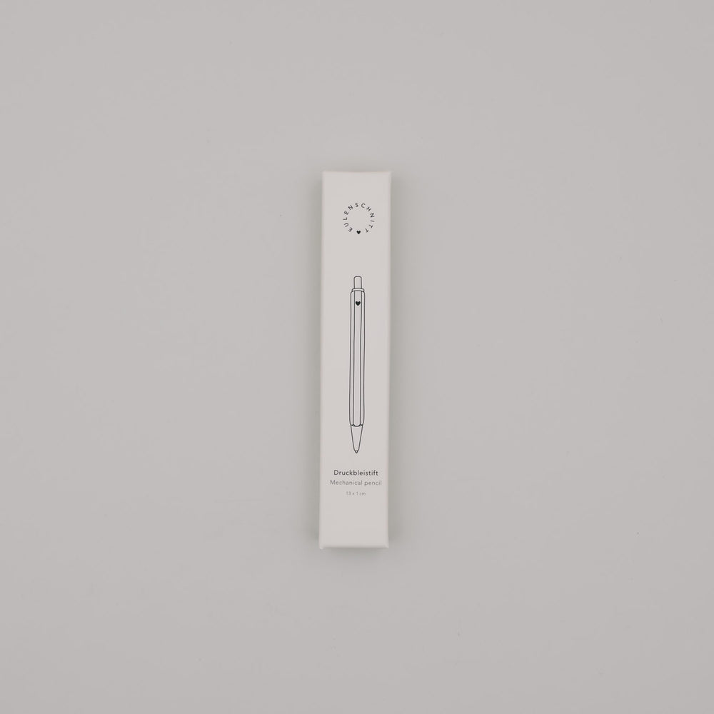 Verpackung des cremefarbenen Druckbleistifts mit minimalistischer Illustration